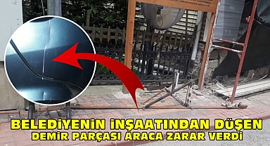 Belediyenin inşaatından düşen demir parçası araca zarar verdi