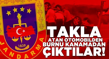 Takla atan otomobilden burnu kanamadan çıktılar!